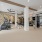 Fitness center with cardio equipment and natural light