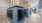 a mail room with blue mail boxes