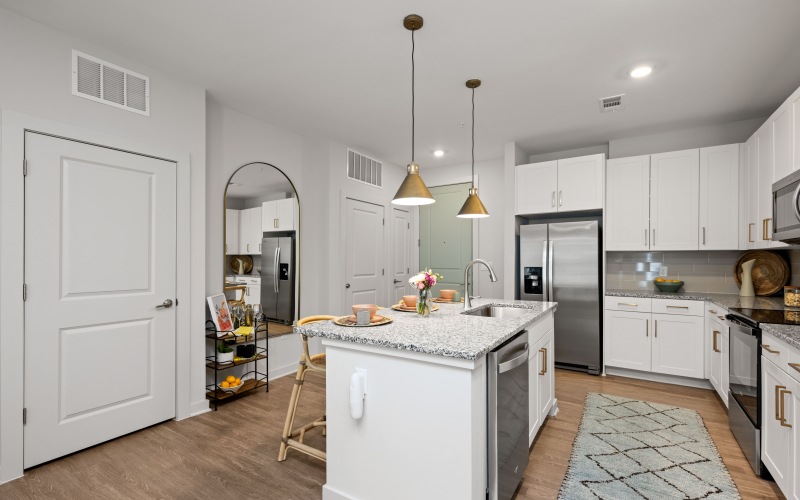 Open-concept kitchen with island and stainless steel appliances
