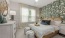 a bedroom with a bed and a lamp