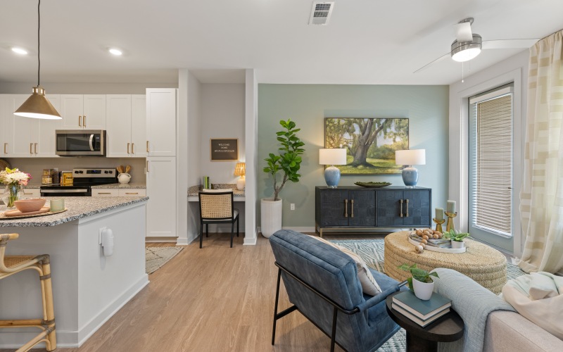 Beautiful living room with built-in desk and ample natural light