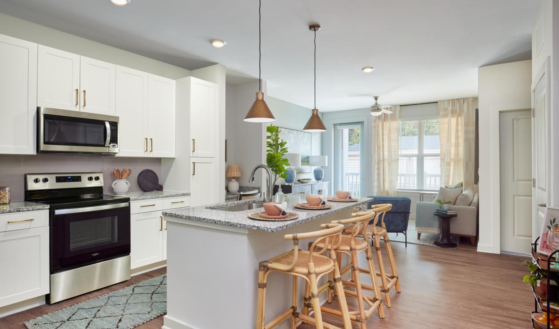 a kitchen with white cabinets